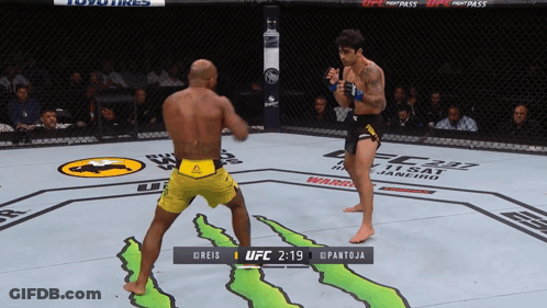 Two Men Fighting In Boxing Ring GIF