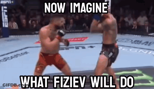 Two Men Fighting In Boxing Ring GIF