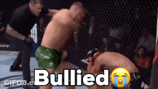 Two Men Fighting In Boxing Ring Bullied GIF
