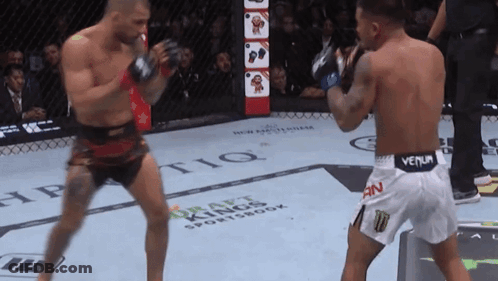 Two Men Fighting In Boxing Ring Draft Kings Sportsbook GIF