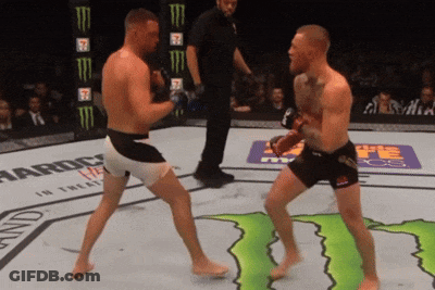 Two Men Fighting In Boxing Ring GIF