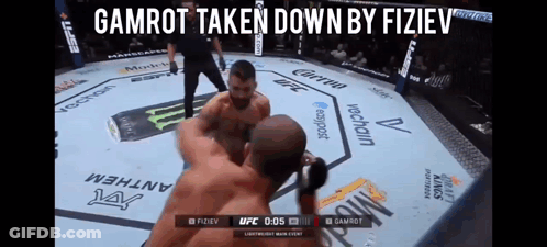 Two Men Fighting In Boxing Ring Gamrot Taken Down By Fiziev GIF