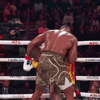 Two Men Fighting In Boxing Ring GIF