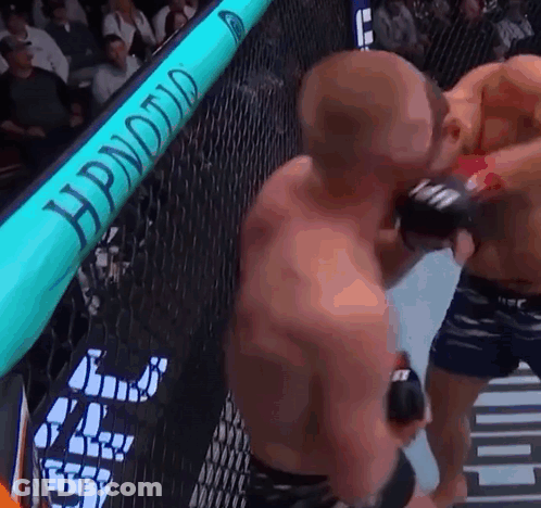 Two Men Fighting In Boxing Ring Hypnotic Sign GIF