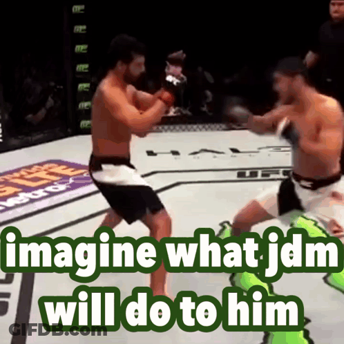 Two Men Fighting In Boxing Ring GIF