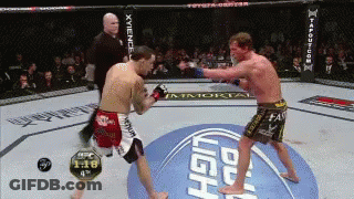 Two Men Fighting In Boxing Ring GIF