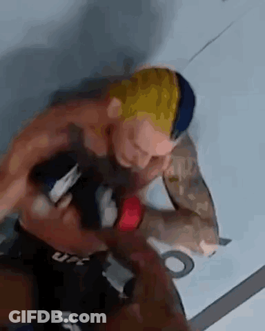 Two Men Fighting In Boxing Ring One Holding Sword GIF