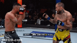 Two Men Fighting In Boxing Ring One In Yellow Shorts GIF