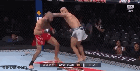 Two Men Fighting In Boxing Ring GIF