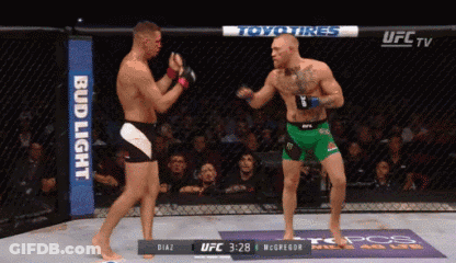 Two Men Fighting In Boxing Ring GIF
