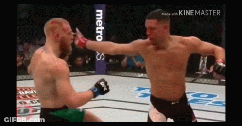Two Men Fighting In Boxing Ring GIF