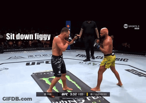 Two Men Fighting In Boxing Ring Saying Sit Down Figgy GIF