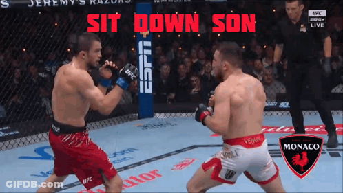 Two Men Fighting In Boxing Ring Saying Sit Down Son GIF