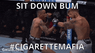 Two Men Fighting In Boxing Ring Sit Down Bum GIF