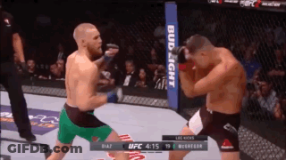 Two Men Fighting In Boxing Ring GIF
