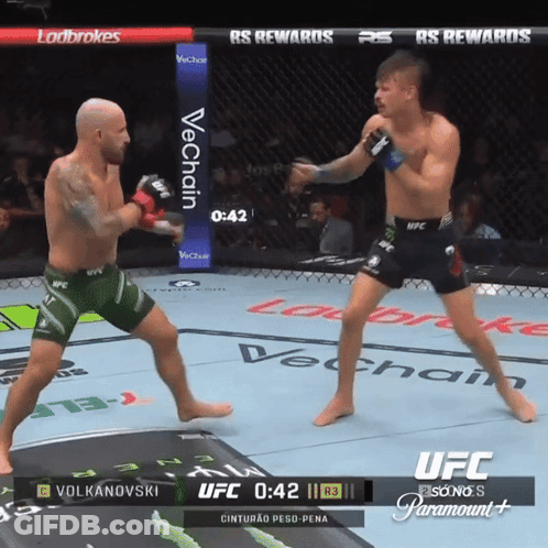 Two Men Fighting In Boxing Ring Sponsored By Paramount GIF