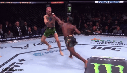 Two Men Fighting In Boxing Ring Sponsored By Toyo GIF