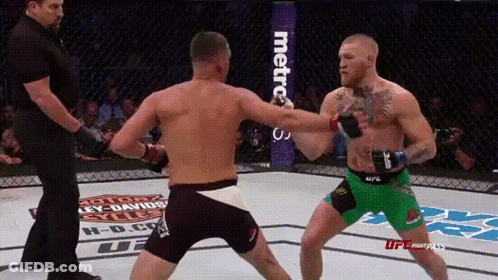 Two Men Fighting In Boxing Ring GIF