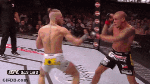 Two Men Fighting In Boxing Ring UFC 3:19 GIF