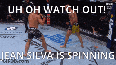 Two Men Fighting In Boxing Ring Uh Oh Watch Out Jean Silva Is Spinning GIF