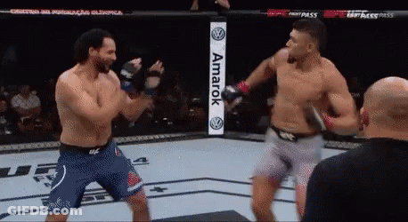 Two Men Fighting In Boxing Ring With Amarok Sign GIF