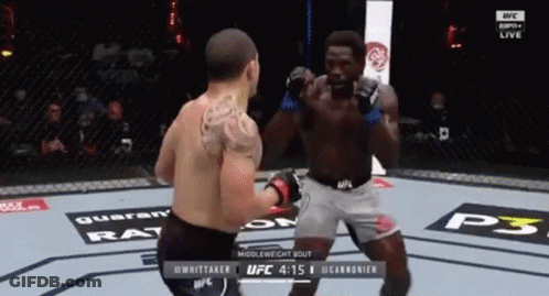 Two Men Fighting In Boxing Ring With Back Tattoo GIF