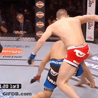 Two Men Fighting In Boxing Ring With Bad Boy Shorts GIF