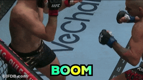 Two Men Fighting In Boxing Ring With Boom GIF