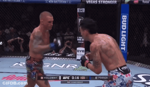 Two Men Fighting In Boxing Ring With Bud Light Ad GIF