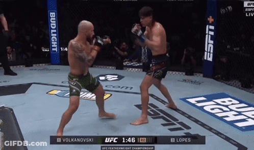 Two Men Fighting In Boxing Ring With Bud Light GIF