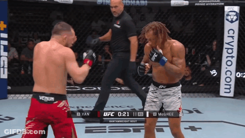 Two Men Fighting In Boxing Ring With Crypto.com Banner GIF