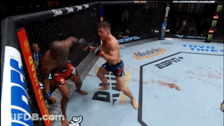 Two Men Fighting In Boxing Ring With ESPN Ad GIF