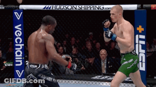Two Men Fighting In Boxing Ring With ESPN Sign GIF
