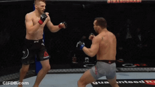 Two Men Fighting In Boxing Ring With ESPN Sign GIF