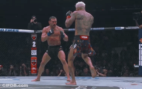 Two Men Fighting In Boxing Ring With Gatorade GIF