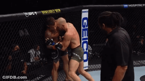 Two Men Fighting In Boxing Ring With Geico Sign GIF