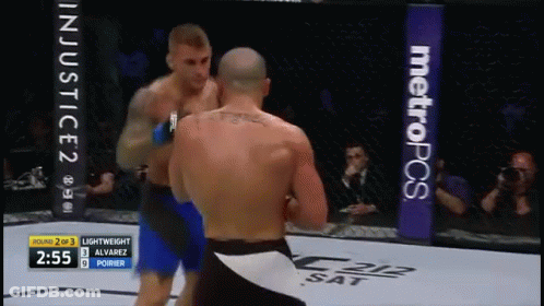 Two Men Fighting In Boxing Ring With MetroPCS Banner GIF
