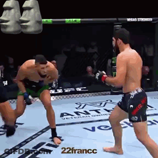 Two Men Fighting In Boxing Ring With Moai Heads GIF