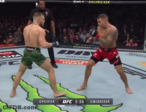Two Men Fighting In Boxing Ring With Monster Energy Ad GIF