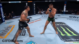 Two Men Fighting In Boxing Ring With Monster Energy Ad GIF