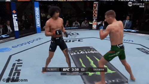 Two Men Fighting In Boxing Ring With Monster Energy Ad GIF