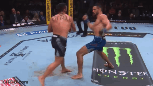 Two Men Fighting In Boxing Ring With Monster Energy Can GIF