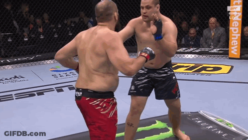 Two Men Fighting In Boxing Ring With Monster Energy Drink GIF