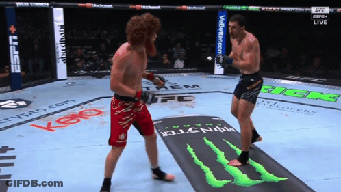 Two Men Fighting In Boxing Ring With Monster Energy Logo GIF