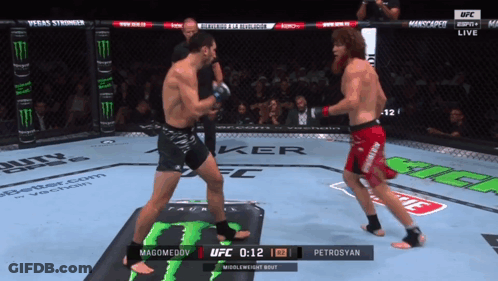 Two Men Fighting In Boxing Ring With Monster Energy Logo GIF