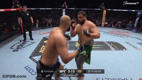 Two Men Fighting In Boxing Ring With Paramount Logo GIF
