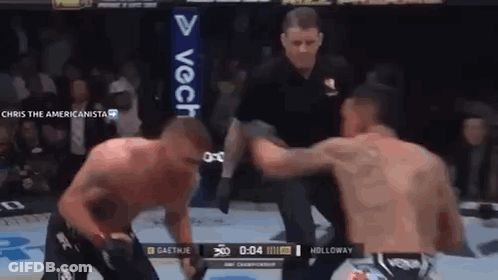 Two Men Fighting In Boxing Ring With Referee GIF