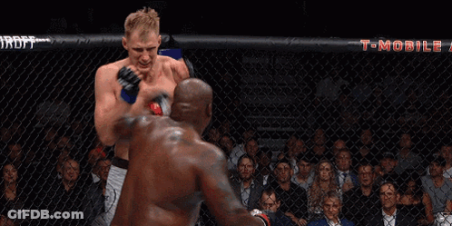 Two Men Fighting In Boxing Ring With T-Mobile Banner GIF
