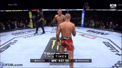 Two Men Fighting In Boxing Ring With Timex Logo GIF