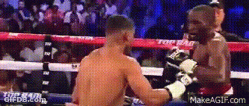 Two Men Fighting In Boxing Ring With Top On Ropes GIF